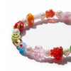 NOGU Beautiful Chaos beaded bracelet with colorful glass flower and smiley beads, faux pearls, and a gold-tone accent.