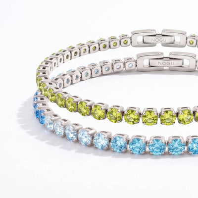 NOGU silver-tone tennis bracelets with square-cut lime green and icy blue crystals, shown with logo clasps.