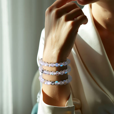 NOGU Women’s Essentials collection featuring three iridescent frosted-bead bracelets with polished silver-tone accents.