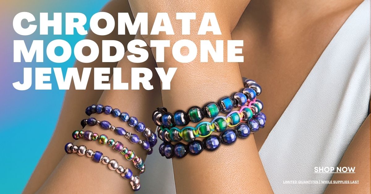 Stacked Chromata Moodstone beaded bracelets in blue, green, pink, and silver tones on a model’s wrist.