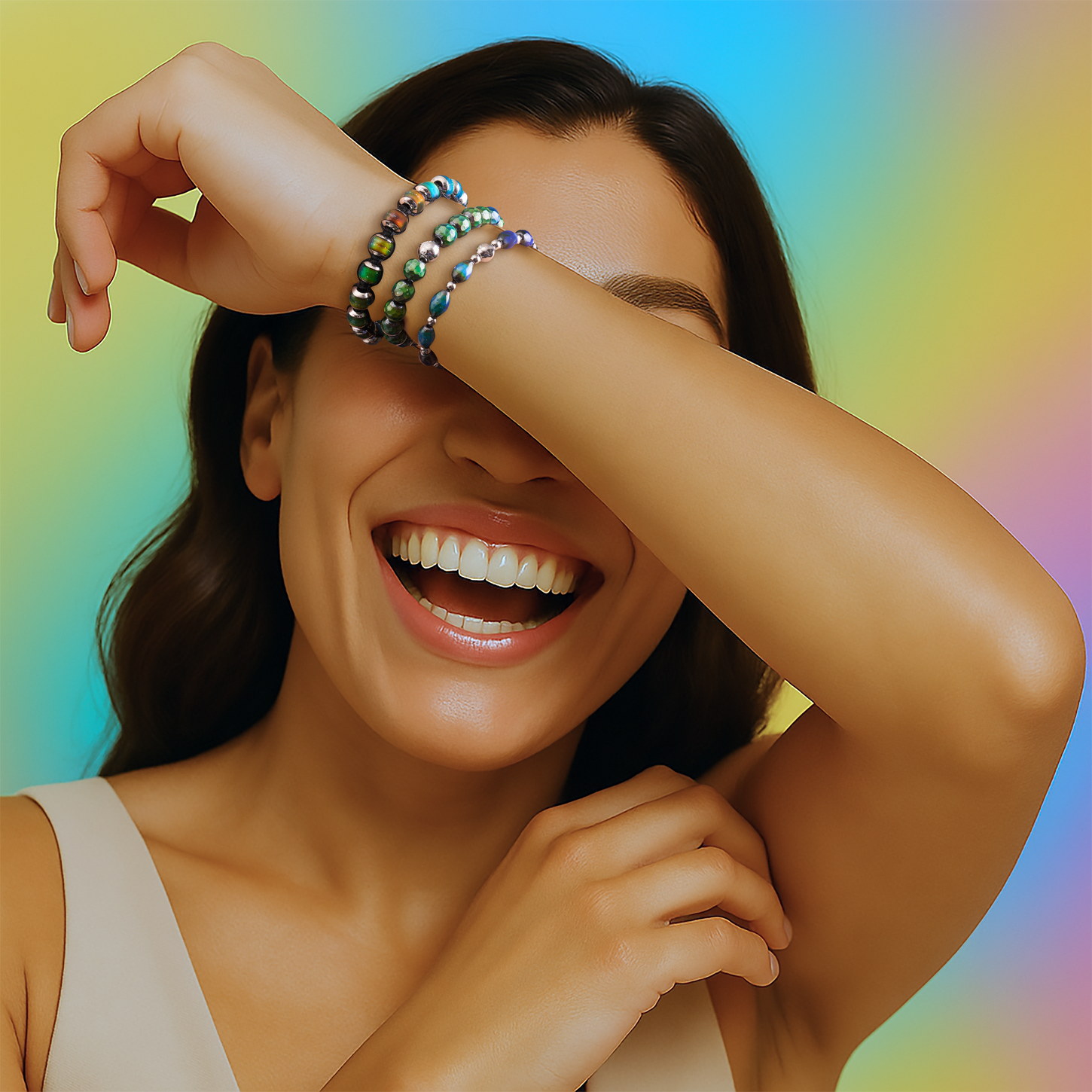 Stacked multicolor beaded stretch bracelets with glossy round stones, styled on a smiling model against a rainbow backdrop.