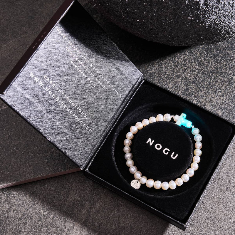 St. Amanda | .925 Sterling Silver | Alabaster Firefly Glass x Ivory Freshwater Pearl Cross Bracelet