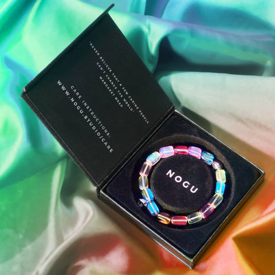 Cosmic Cascade Galaxy Glass Pebble Bracelet with multicolor beads and sterling silver by NOGU in black branded box