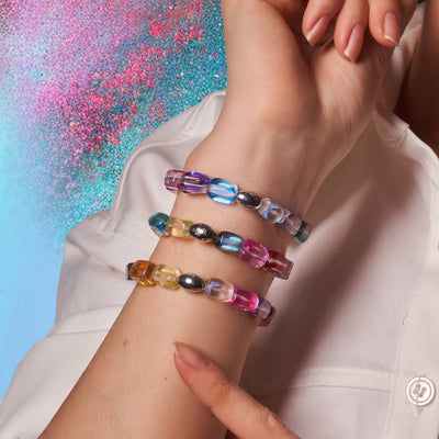 Cosmic Cascade bracelets with iridescent multicolor Galaxy Glass beads and sterling silver beads on wrist by NOGU