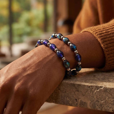 Chromata Fabergé stretch bracelet with oval color-changing blue, teal and purple mood stone beads and silver stainless steel accents.