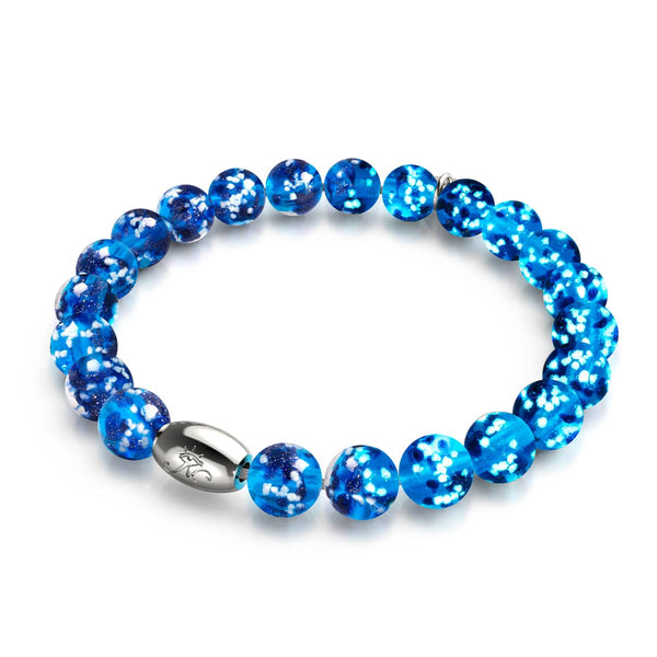 Topaz Flame bracelet with glowing blue Firefly Glass beads on clear elastic and .925 sterling silver clasp by NOGU